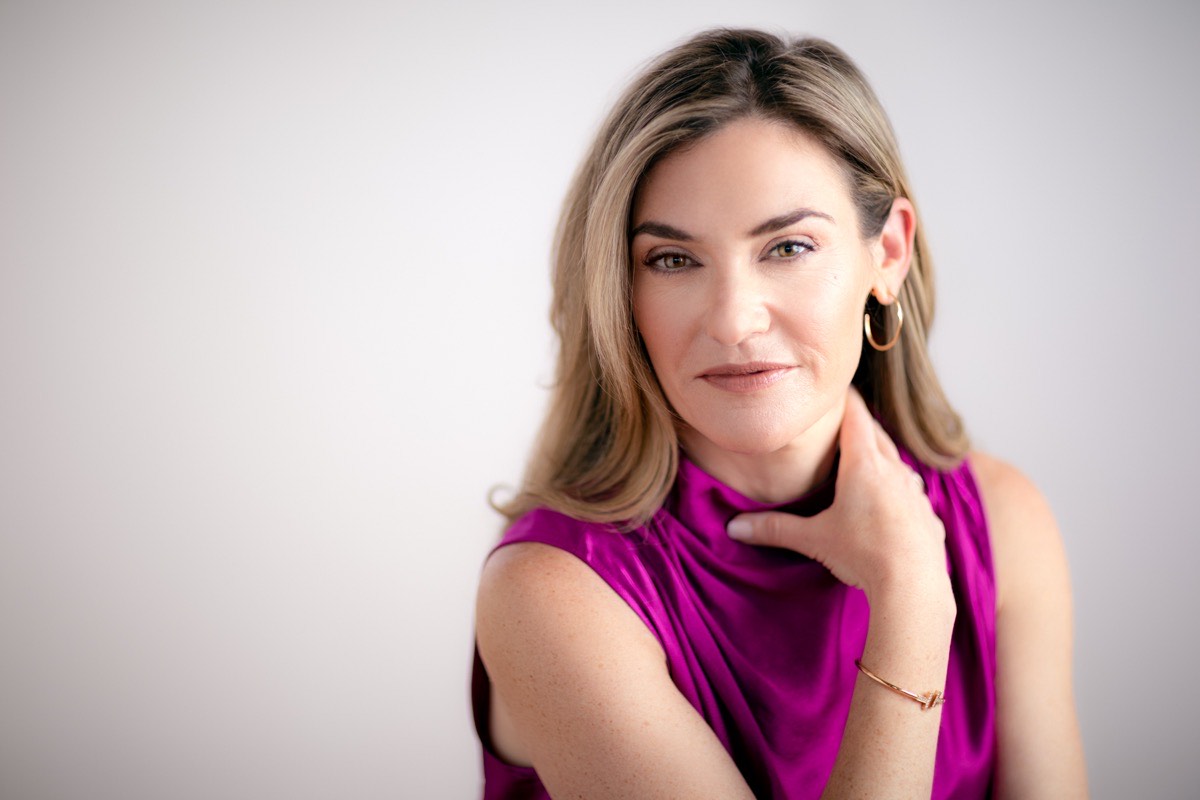 Katy Mickelson headshot, magenta